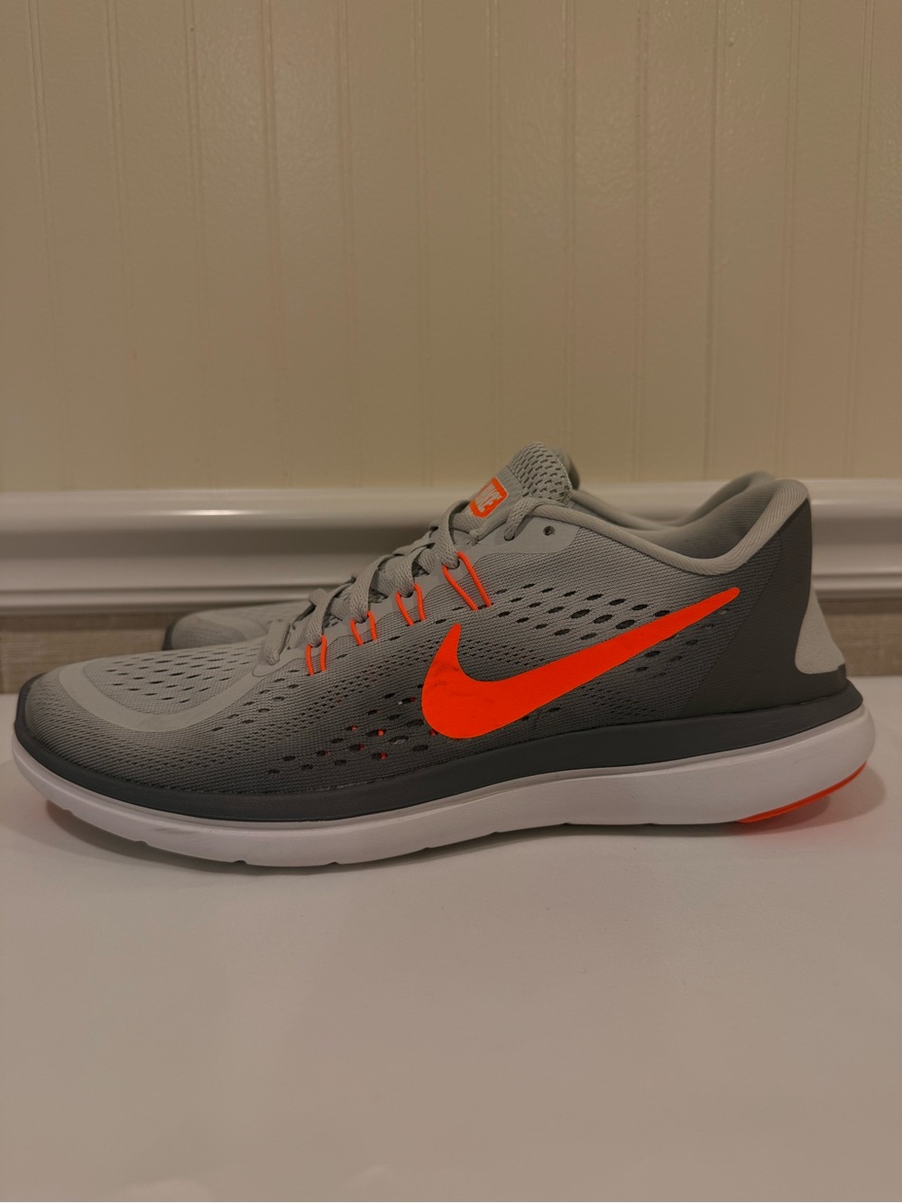 Nike Light Grey Sneakers with Orange Accents